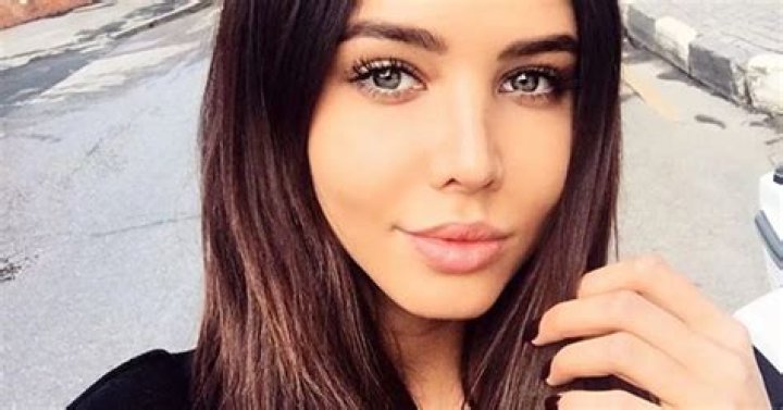 Outrage as beauty queen fires machine gun while balancing on car roof